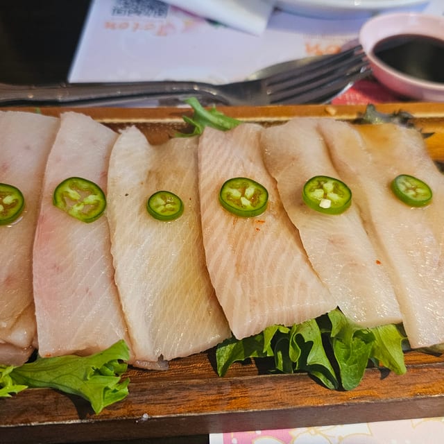 'Hamachi Jalapeño (8 Slices of Yellowtail with Pesto Soy Sauce) '.